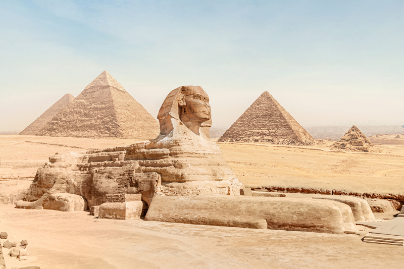 great sphinx with body lion face pharaoh lies sand against background all famous pyramids giza bright sunny sky cairo egypt